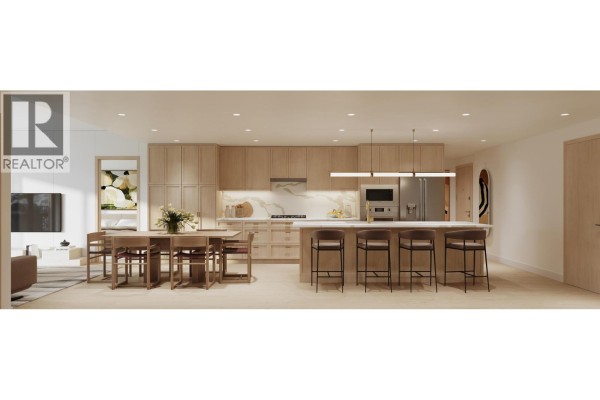 Wide view of an open concept living, dining, and kitchen area with light wood cabinetry. - Ph2 4451 Hastings Street, Burnaby