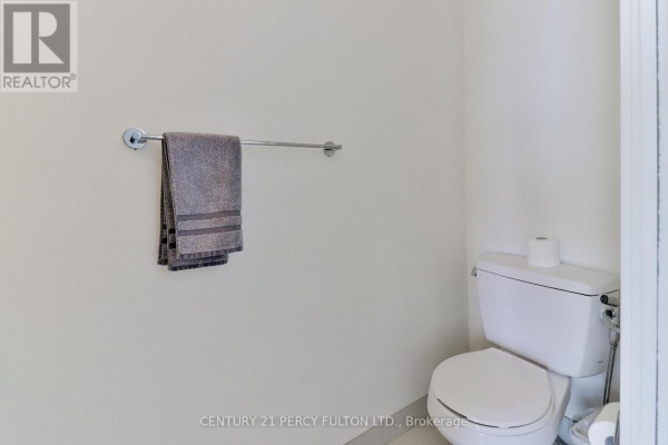 Toilet and towel rack in a white bathroom. - Ph3505 - 105 The Queensway Avenue, Toronto