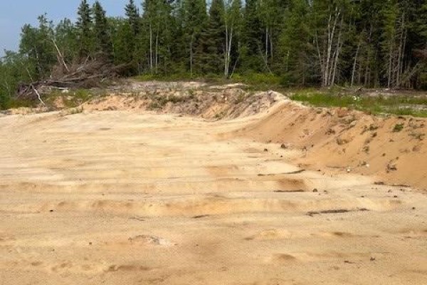 Aerial view showing tree cover and a path winding through the wooded property. - Pt Lt 11, Concession 4 Birchill Road E, Cochrane