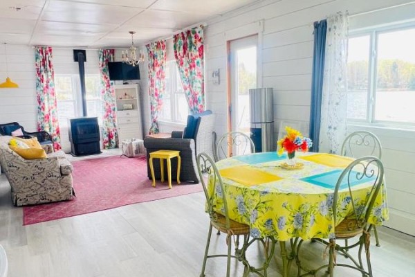Deck with a glass table and chairs, and a black grill next to a white cottage. - Pt Lt 14 K&p Trail, Frontenac