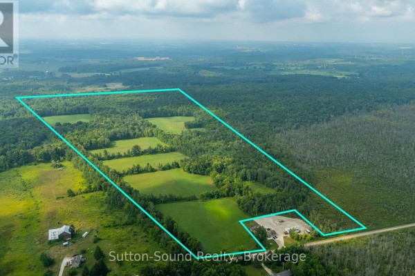 A large mowed field with a tree line and clear sky overhead. - Pt Lt 35-36 Centre Diagonal Road, South Bruce Peninsula