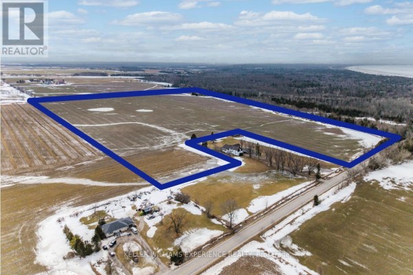Aerial view highlighting the property boundaries with fields and wooded areas. - Pt N 1/2 Lt 19 10 Concession, Springwater