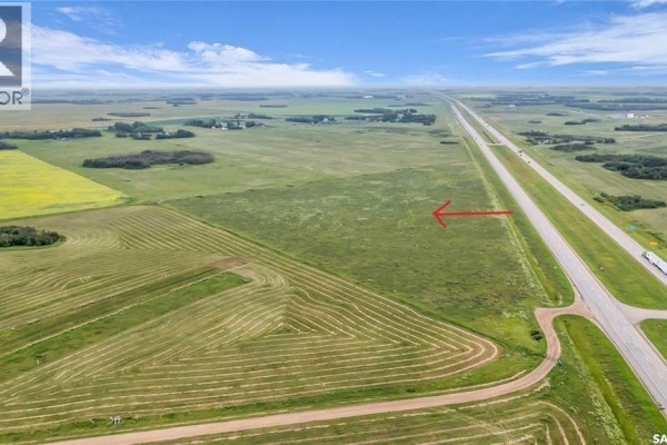 Aerial view of undeveloped land with a red arrow indicating a section by the highway. - Ramsahoi Land ....18.16 Acres, Corman Park Rm No  344