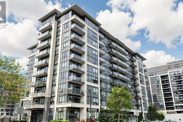 Exterior view of a multi-story modern apartment building with glass balconies and windows. - Rg7 - 396 Highway 7 E, Richmond Hill