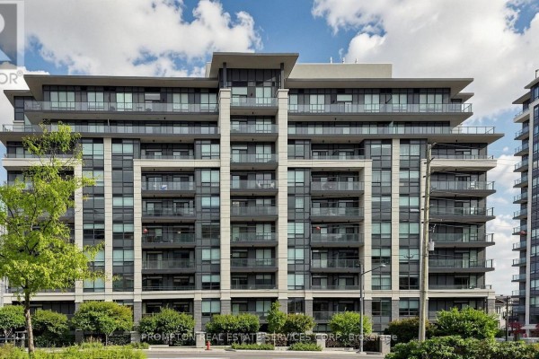 Facade of a tall apartment building with multiple levels of balconies and glass windows. - Rg7 - 396 Highway 7 E, Richmond Hill