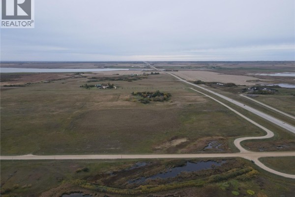 Overhead view of a vast, mostly flat landscape with roads, fields, and water features. - Rm Of Blucher Land, Blucher Rm No  343