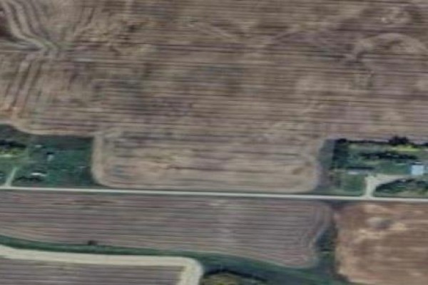 Distant aerial perspective of the property and its location within cultivated land. - Rm Of Buchanan Acreage, Buchanan Rm No  304