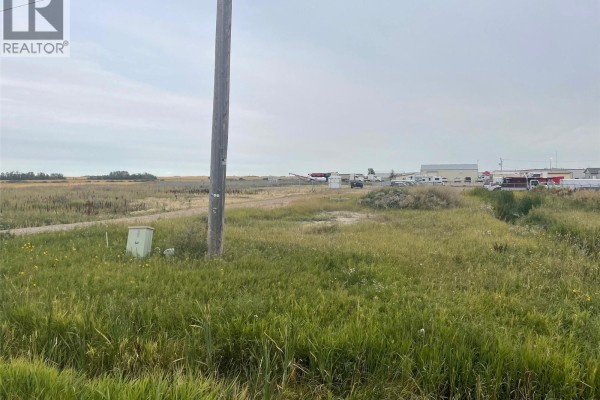 View of the property with tall grass and a utility pole in the foreground. - Rm Of Wallace Ochs Land, Wallace Rm No  243