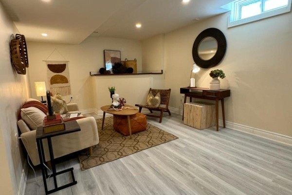 A kitchen area with white appliances, white cabinets, a microwave, and a sink. - Room 2 - 248 Crossland Gate, Newmarket
