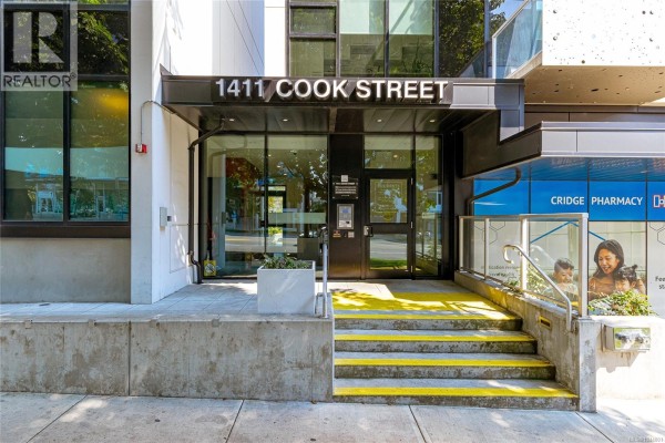 Entrance to the 1411 Cook Street building with glass doors and steps. - S404 1411 Cook St, Victoria