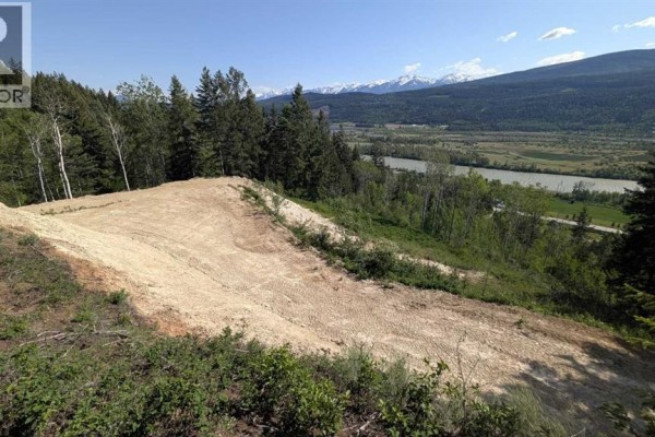 Expansive view of a valley, river, and mountains from a cleared, elevated lot. - Site #15, 3483 Highway 95, Out Of Province_alberta