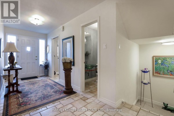 Entryway with front door, staircase, and decorative rug - Th16 - 18 La Rose Avenue, Toronto