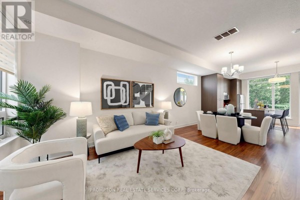 Living and dining area with white dining set, dark wood cabinets, and chandelier. - Th17 - 88 Sheppard Avenue E, Toronto