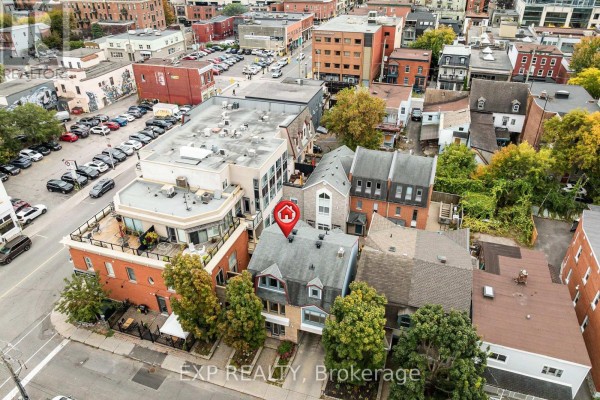 Aerial view of the building surrounded by other urban structures. - Unit 1 Level 1 - 122 Guigues Avenue W, Ottawa