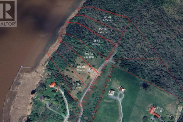 Aerial view of multiple lots bordering a body of water, with property lines outlined. - Unit 2 Avon Spirit Lane, Avondale