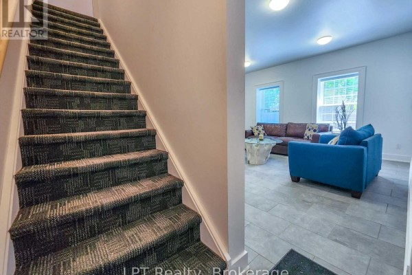 Staircase with carpet leading to a living area featuring a sectional sofa and coffee table. - Unit #3 - 12 Leggett Lane, Kincardine