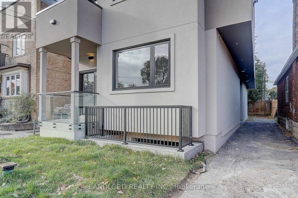 Exterior detail of modern building with glass railing porch. - Unit 4 - 1344 Pape Avenue, Toronto