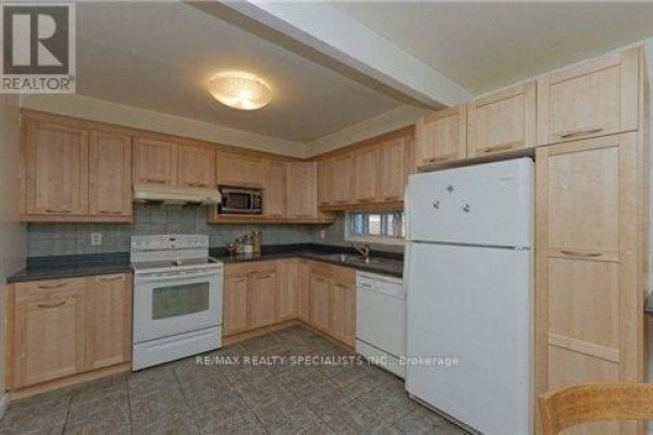 Kitchen with light wood cabinets, white stove, dishwasher, and refrigerator. - Upper - 290 Mcnicoll Avenue, Toronto