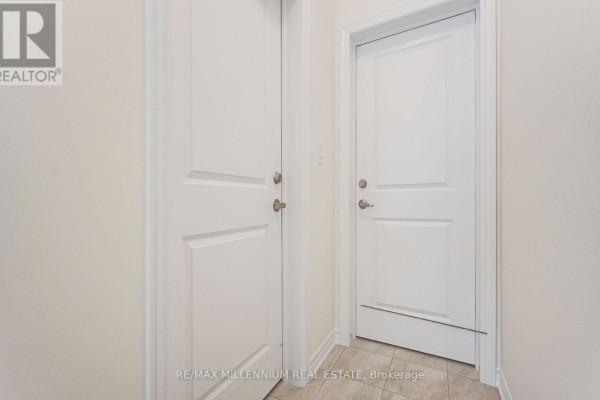 Interior view of two white doors with brushed nickel hardware in a hallway. - Upper - 34 Thornbird Crescent, Brampton
