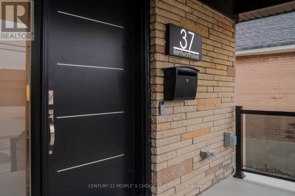 Backyard with a concrete patio, a large grassy area, and trees. - Upper - 37 Bentworth Avenue, Toronto