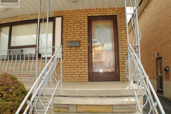 Close-up of the front entrance, showing the porch, door, and brick facade. - Upper Floor - 49 Algoma Street, Toronto