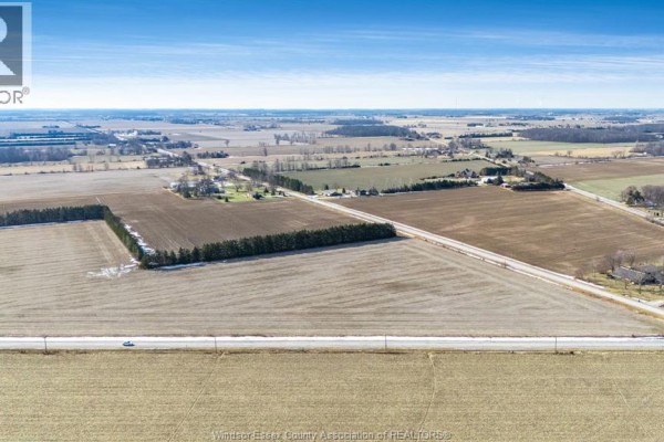 Aerial view of agricultural land with road access and nearby residential properties. - V/l South Talbot, Tecumseh
