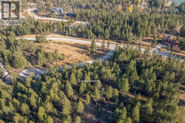 Aerial view of rolling wooded hills with paved roads and scattered homes. - Valley Vista Way Lot# 24, Fairmont Hot Springs