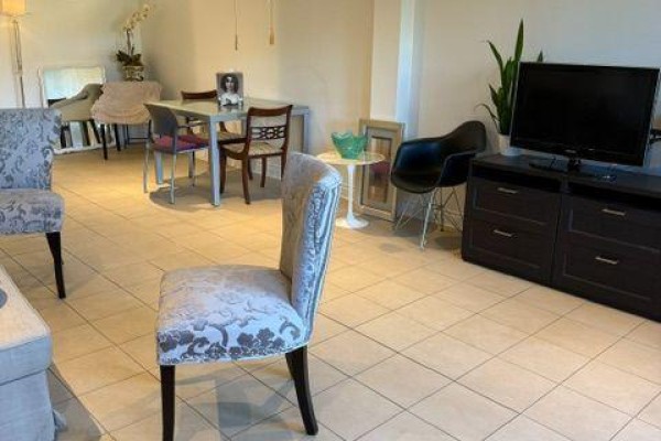 Basement area with dining table, chairs, television, and furniture with tiled floor. - W/o Basement - 21 Bristlewood Crescent, Vaughan